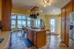 Fully stocked Kitchen with Kitchen Island and Dining area