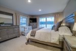 Master Bedroom on the main floor with King bed and child`s crib