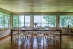 Dining area with large windows looking right out over the lake