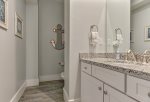 Down the entryway hall is a half bathroom.
