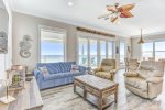 Spacious living area with a large deck to watch the waves