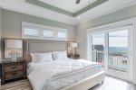 King master suite with en-suite, flat screen TV, and direct balcony access.