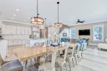 Open floor plan with living, dining, and kitchen