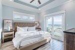 King master suite with flat screen TV, en-suite, & direct balcony access.