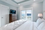 King master suite with en-suite, flat screen TV, and direct balcony access.