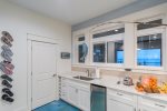 Wet bar located on the lower level. Back door will lead you out to the deck and BBQ area.  2nd refrigerator located on this level.  