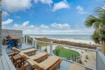 Plenty of lounge chairs to relax and watch the waves roll in