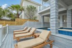 Plenty of lounge chairs to relax and watch the waves roll in