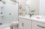 Connected bathroom with walk-in shower.