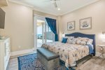King bedroom located on the lower level.  Slider door leads out to the Tiki Bar area, along with an ocean view.  