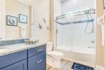 There are two bathrooms in addition to one of the master suites that offer bathtubs for the little ones and soaking.