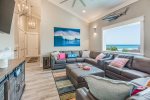 Media room on the third floor has plenty of seating for movies and games with a large TV and fantastic sunset views.  It also has two pull out sleeper sofas for extra room.