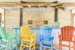 The lower level features a custom built tiki bar for plenty of BBQ and relax. Two of the king en suites are located on the lower level and have sliding glass doors that open up and look out directly to the ocean.