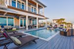 The large pool, complete with 6 jacuzzi jets, sits right outside the door on the 2nd floor main living level.  The views from this deck are nothing short of amazing with clear views of both the city and county piers.