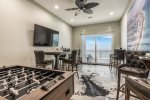 Entertainment room leading out to the deck, with an ocean view