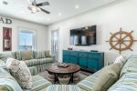 Plenty of seating to lounge and watch the flat screen.