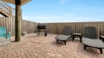 Furnished pool deck with charcoal grill