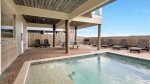 Private pool deck area with plenty of lounge chairs