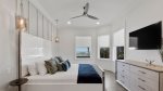 Ground floor king master suite with pool view and partial beach view
