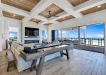 2nd floor living area with accordion balcony doors