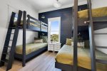 2nd floor multi bunk room featuring twin over twin and twin over queen