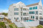 Back view of Sea Breeze Featuring Large Private Pool and Furnished Balconies on all Levels