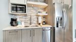 1st floor living room with full kitchenette