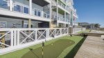 Putting green outside pool deck area