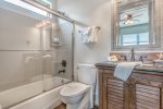 Attached bathroom with tub/shower combo