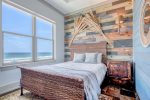 Queen master bedroom with beach views.