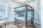 Queen over Queen bunk with Queen trundle, bedroom sleeps 6 guests.
