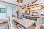 Seating at the bar and table area.  Stainless steal appliances