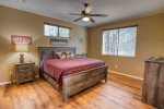 Primary bedroom with bathroom and TV