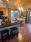 Open floor plan with breakfast bar