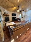 Relax by the fireplace in the living room