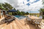 Deck with ocean view and pool at Oak Street House