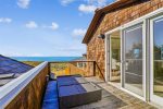 Private deck off the 1st primary bedroom at Oak Street House