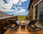 Private deck off the 1st primary bedroom at Oak Street House