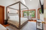 Primary bedroom with king bed at Puffin`s on Larch