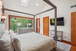 Primary bedroom with king bed at Puffin`s on Larch