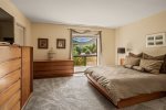 Bedroom 2 has a queen size bed, walk-in closet and flat screen TV