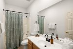 Guest bathroom with a tub/shower combo