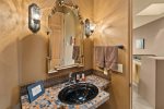 There is a guest bathroom upstairs near the living room, dining room and kitchen