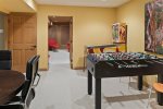 The lower level of the home is where the fun begins, chill time with friends and family, challenge your friends to foosball