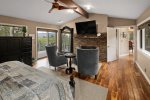 This spacious suite has a seating area with a flat screen TV and fireplace