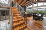 Custom staircase to the upper and lower levels of the home