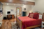This guest suite features a queen size bed and a desk for remote working or homeschooling