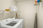 Laundry room with plenty of space located between the kitchen and garage