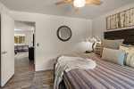 Inviting king bed and ceiling fan for summer