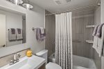 Newly remodeled bathroom with relaxing bathtub and shower